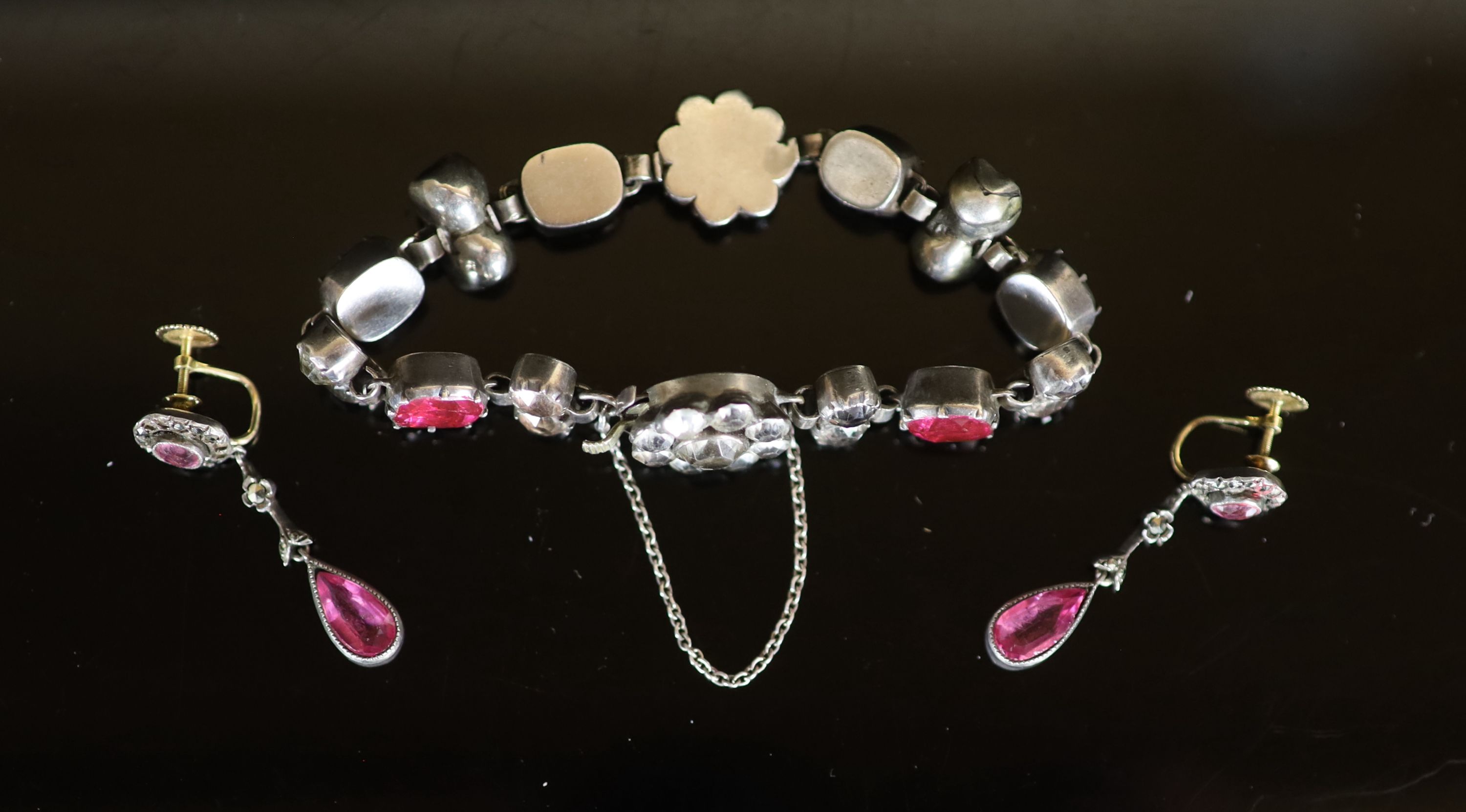 A silver and two colour paste set bracelet and a pair of gold and silver, marcasite and pink paste set drop ear clips